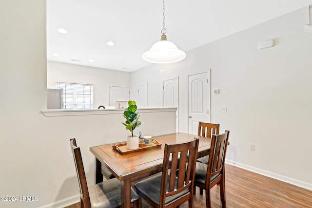 dining room featuring wood-type flooring