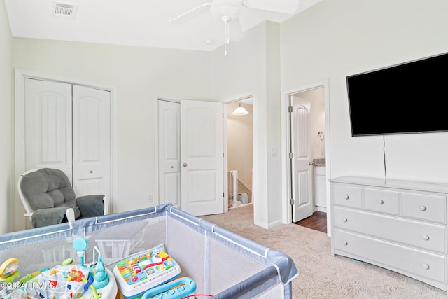 bedroom featuring ceiling fan, lofted ceiling, and dark carpet