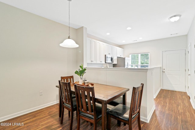 dining room featuring dark wood-type flooring