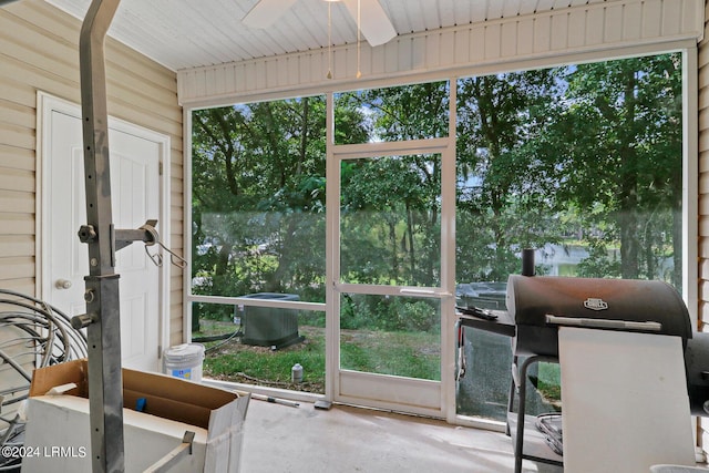 sunroom / solarium featuring a wealth of natural light and ceiling fan