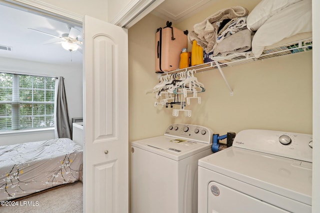 laundry room featuring carpet, washing machine and clothes dryer, and ceiling fan