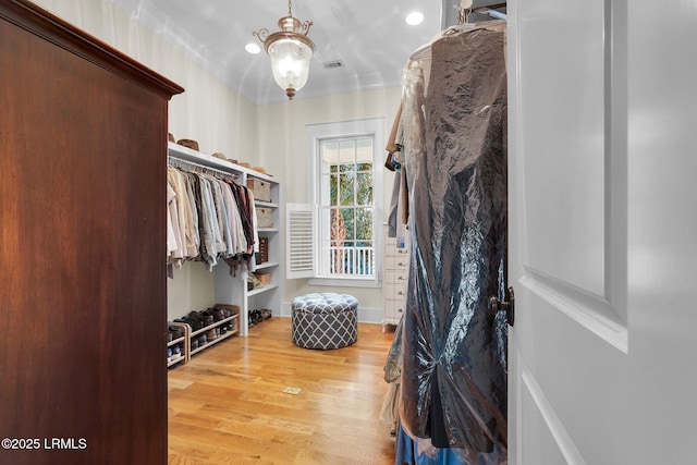 spacious closet with visible vents and wood finished floors