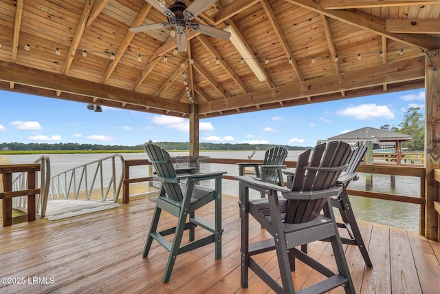 wooden deck with a gazebo and a water view