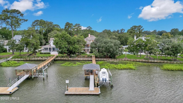 dock area with a water view and boat lift