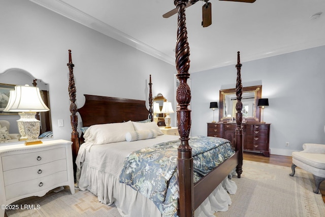 bedroom featuring light wood-style flooring, baseboards, ornamental molding, and a ceiling fan