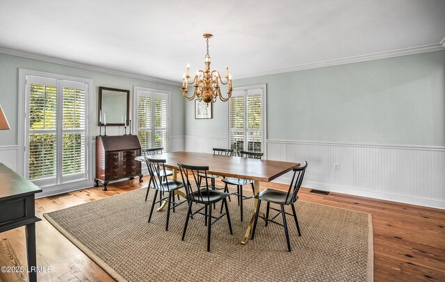 79 Lost Island Rd, Beaufort, SC 29907 - dining room with a notable chandelier, ornamental molding, and visible vents