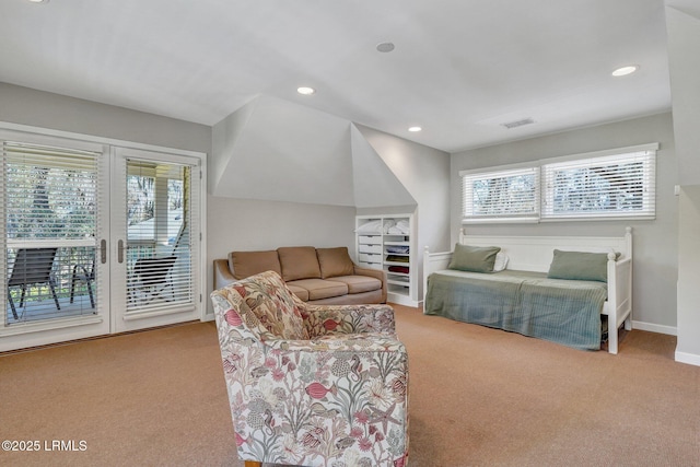 carpeted living area featuring baseboards, visible vents, and recessed lighting