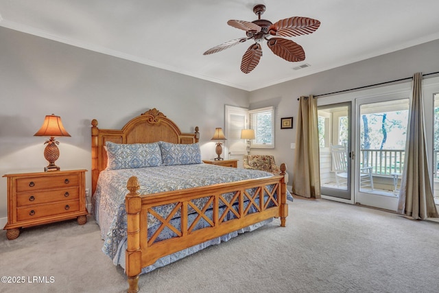 carpeted bedroom with ceiling fan, ornamental molding, visible vents, and access to exterior