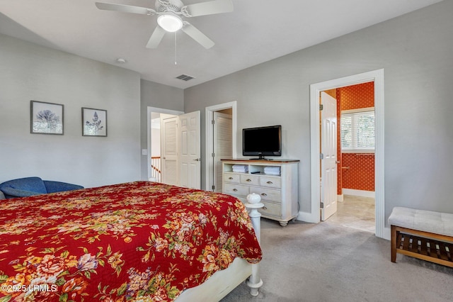 bedroom with baseboards, visible vents, a ceiling fan, and light colored carpet