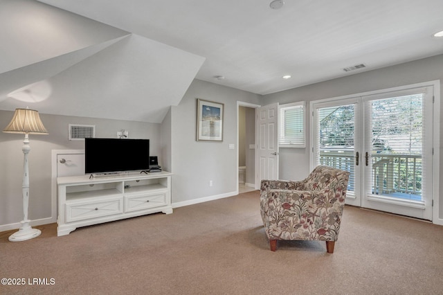 sitting room featuring french doors, visible vents, baseboards, and carpet flooring