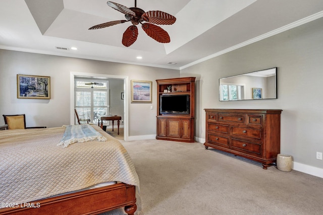 bedroom featuring light carpet, visible vents, baseboards, ornamental molding, and a raised ceiling