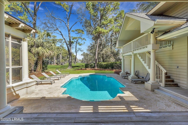 pool with stairs and a patio