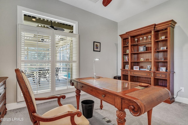 home office featuring a ceiling fan, carpet flooring, and baseboards