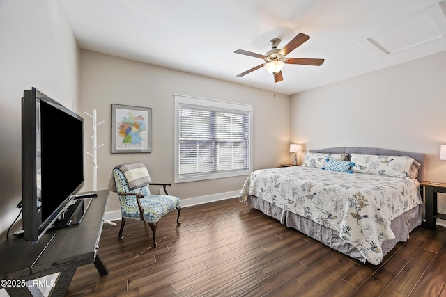 bedroom featuring attic access, dark wood-style flooring, ceiling fan, and baseboards