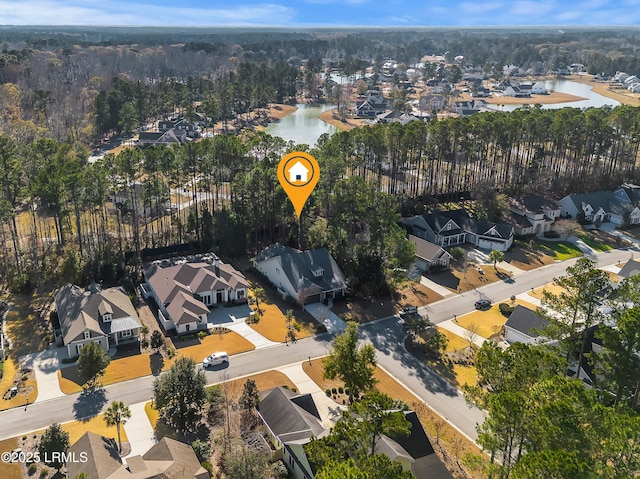 birds eye view of property with a residential view and a water view