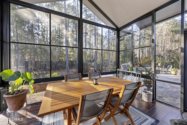 sunroom featuring lofted ceiling