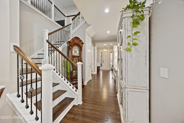 foyer entrance featuring dark wood-style floors and recessed lighting