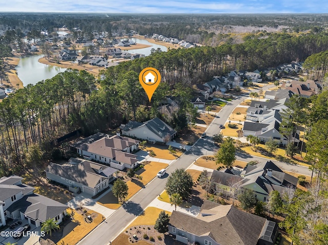 bird's eye view featuring a residential view and a water view