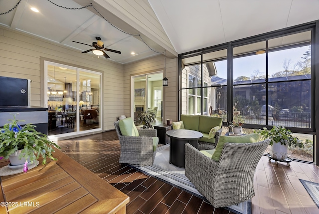 sunroom / solarium featuring a wealth of natural light and ceiling fan