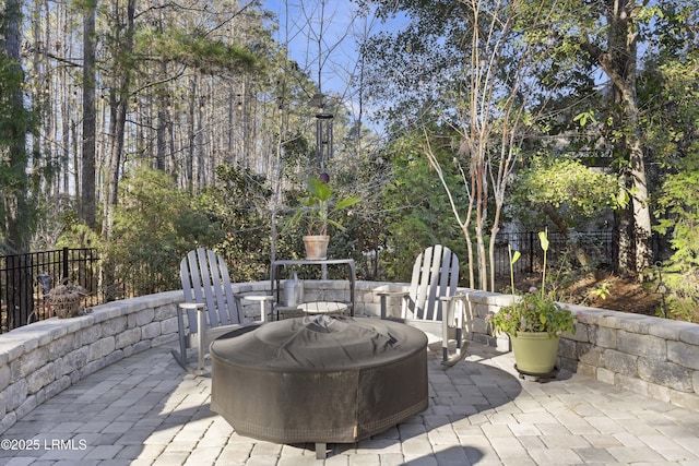 view of patio / terrace featuring fence