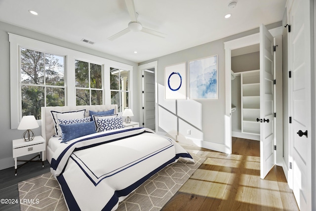 bedroom with wood-type flooring and ceiling fan