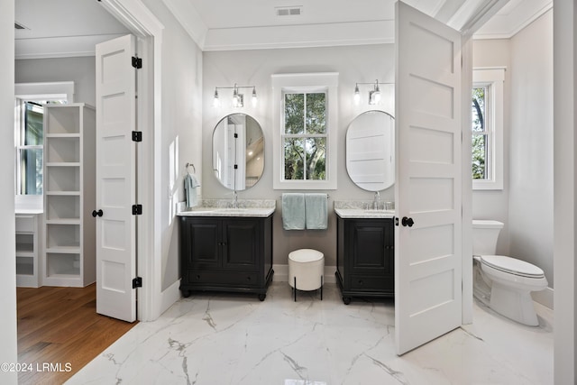 bathroom with vanity and crown molding