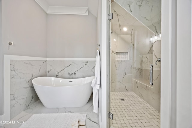 bathroom with ornamental molding and plus walk in shower