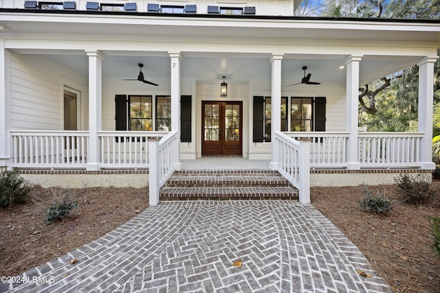 property entrance featuring covered porch, ceiling fan, and french doors