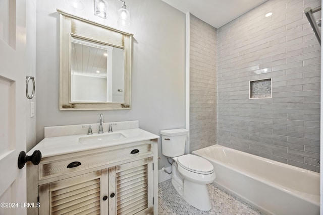 full bathroom featuring vanity, toilet, and tiled shower / bath combo