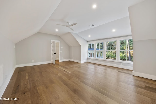 bonus room with ceiling fan, lofted ceiling, and hardwood / wood-style floors