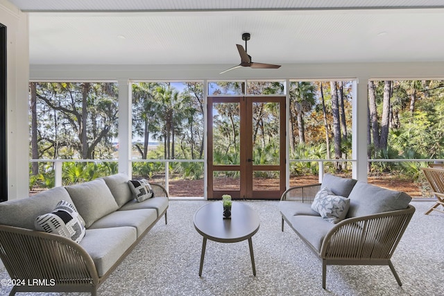 sunroom featuring ceiling fan