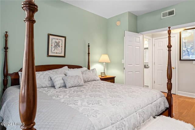 bedroom with hardwood / wood-style flooring