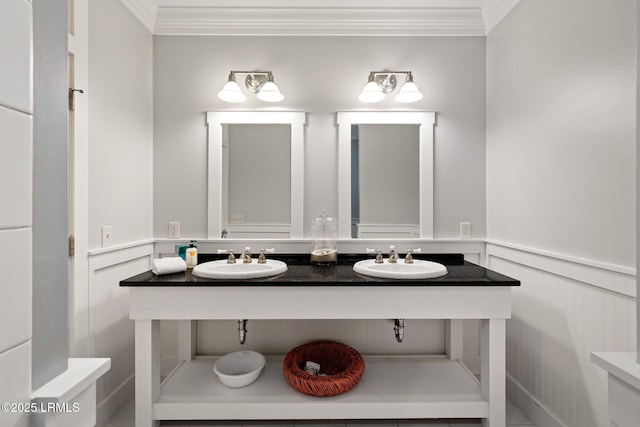 bathroom with crown molding and vanity