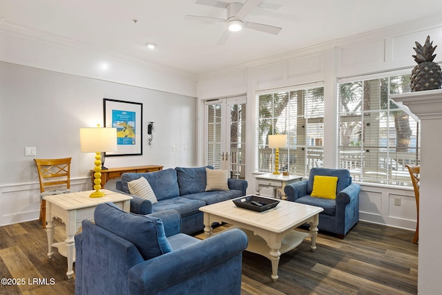 living room with dark hardwood / wood-style flooring, crown molding, plenty of natural light, and ceiling fan