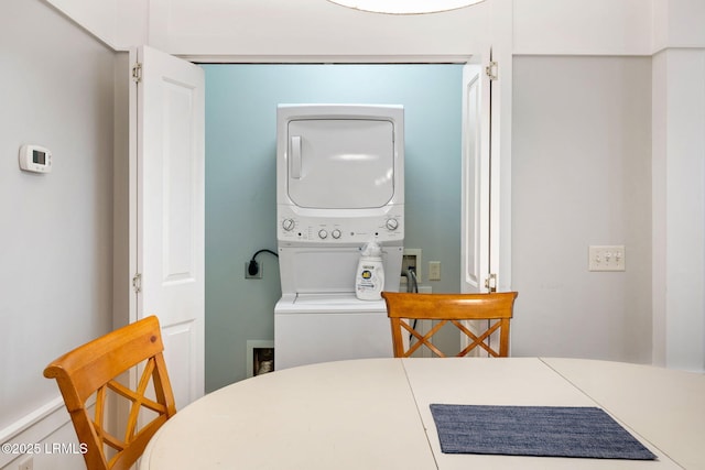 washroom with stacked washer and dryer