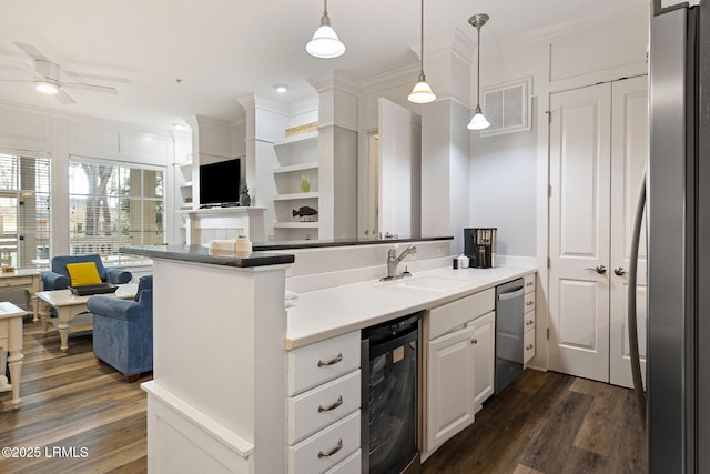 kitchen with sink, appliances with stainless steel finishes, white cabinetry, ornamental molding, and beverage cooler