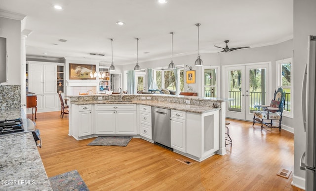 5 Petigru Dr, Beaufort, SC 29902 - kitchen featuring appliances with stainless steel finishes, ceiling fan, ornamental molding, light wood finished floors, and white cabinetry