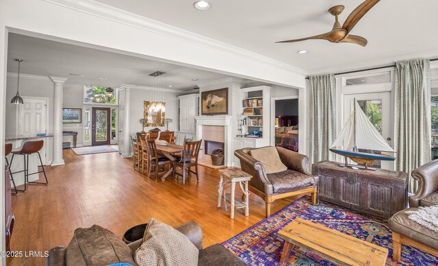 5 Petigru Dr, Beaufort, SC 29902 - living room featuring a fireplace, recessed lighting, ornamental molding, light wood-style floors, and ceiling fan