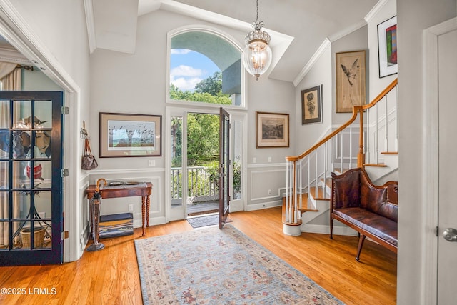 5 Petigru Dr, Beaufort, SC 29902 - entrance foyer with stairway, ornamental molding, a chandelier, wood finished floors, and high vaulted ceiling