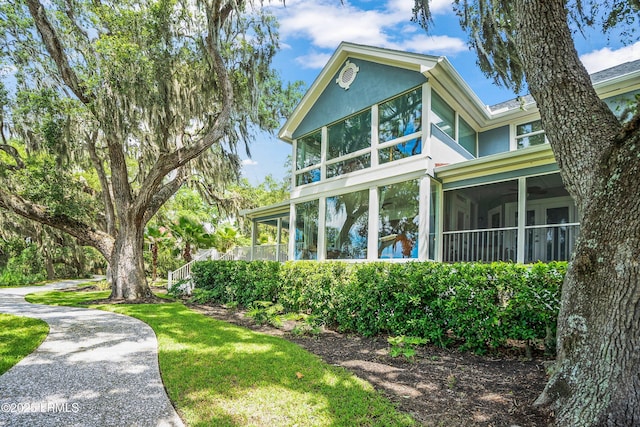5 Petigru Dr, Beaufort, SC 29902 - view of property exterior featuring a sunroom and stucco siding