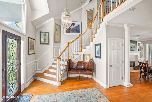 5 Petigru Dr, Beaufort, SC 29902 - foyer entrance with stairs, wood finished floors, a towering ceiling, crown molding, and a chandelier