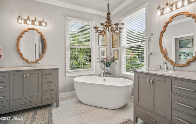 5 Petigru Dr, Beaufort, SC 29902 - bathroom featuring a chandelier, two vanities, ornamental molding, and a soaking tub