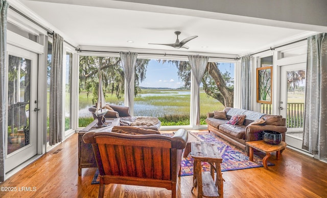 5 Petigru Dr, Beaufort, SC 29902 - sunroom / solarium with wood finished floors, a water view, and french doors