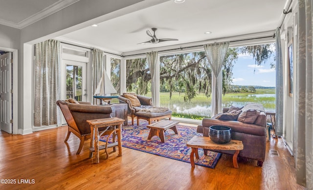 5 Petigru Dr, Beaufort, SC 29902 - sunroom / solarium featuring wood finished floors, plenty of natural light, ornamental molding, and a water view