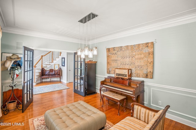 5 Petigru Dr, Beaufort, SC 29902 - living area featuring french doors, stairs, crown molding, and wood finished floors