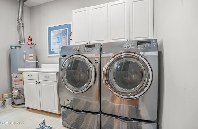 5 Petigru Dr, Beaufort, SC 29902 - laundry area with water heater, washing machine and clothes dryer, cabinet space, and light tile patterned floors