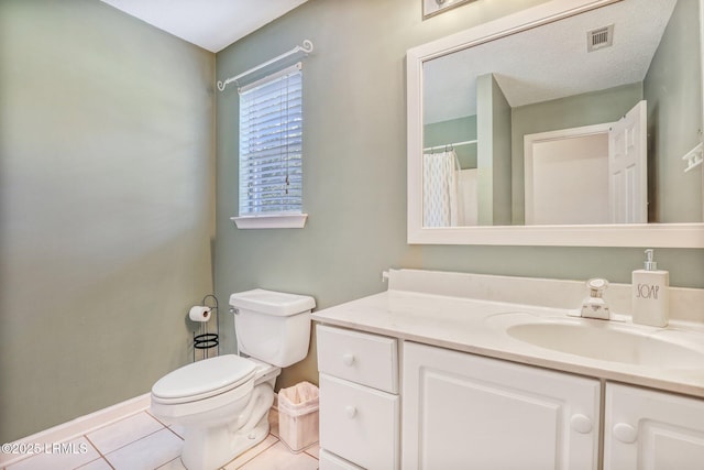 full bathroom featuring visible vents, toilet, vanity, and tile patterned floors