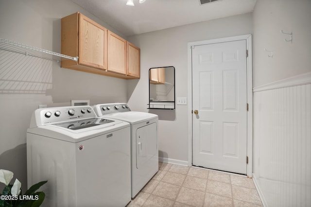 laundry area featuring cabinets and washing machine and clothes dryer