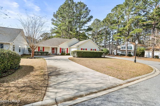 view of front of home featuring a garage and a front lawn