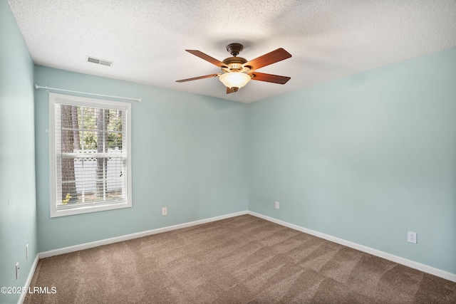 unfurnished room featuring ceiling fan, carpet flooring, and a textured ceiling